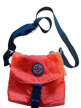 Kipling Coral-Orange Crossbody with Black Strap